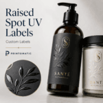 Custom raised Spot UV labels with glossy textured highlights on selected design areas by Printomatic.