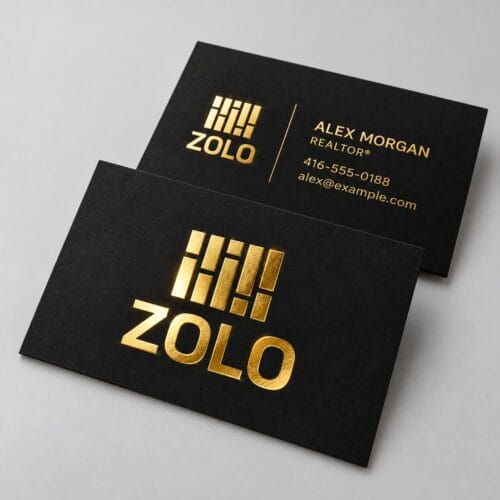 Zolo business cards with gold metallic foil on a black card, front and back